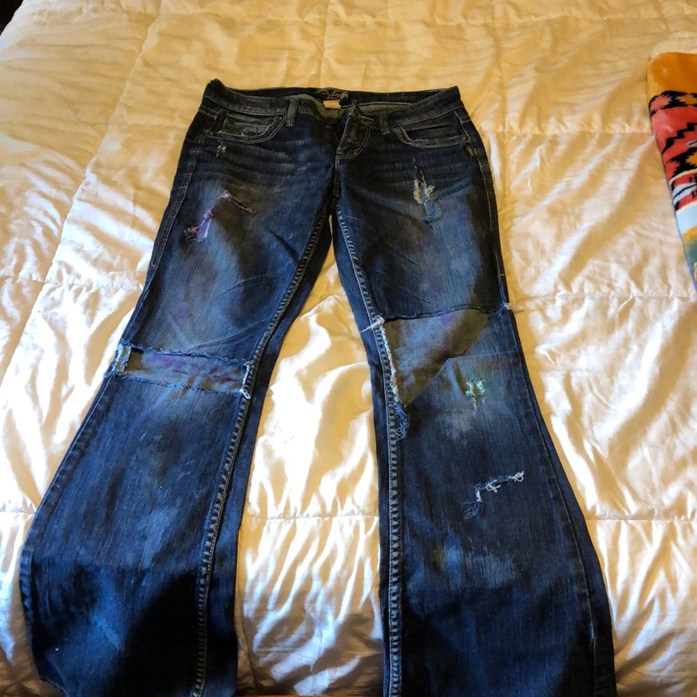 Custom distressed sliver jeans